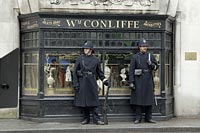 Victorian policemen guarding shop