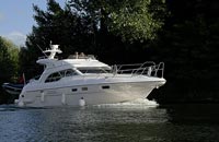 Fly deck motor cruiser on River Thames