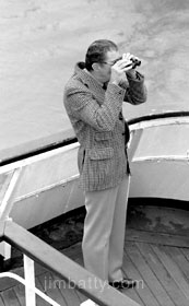 Man with binoculars on deck of ferry to Dieppe