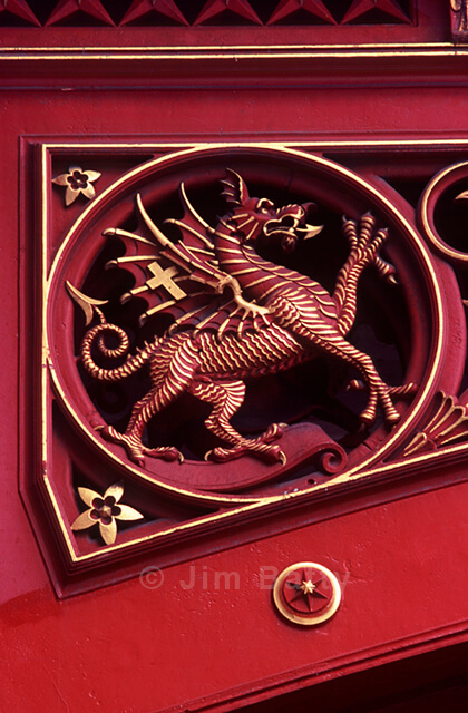 Dragon roundel - detail of ornamented ironwork on Holborn Viaduct Red dragon rampant piqued out with gold linework - detail of ornamented ironwork on Holborn Viaduct