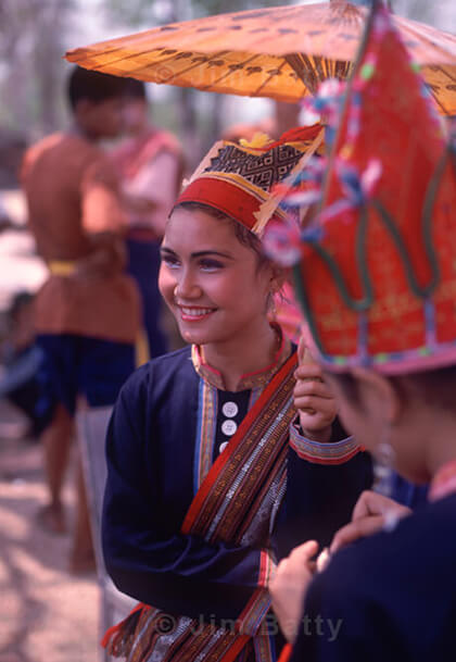 Khmer woman dancer under paper umbrella in Northeast Thailand