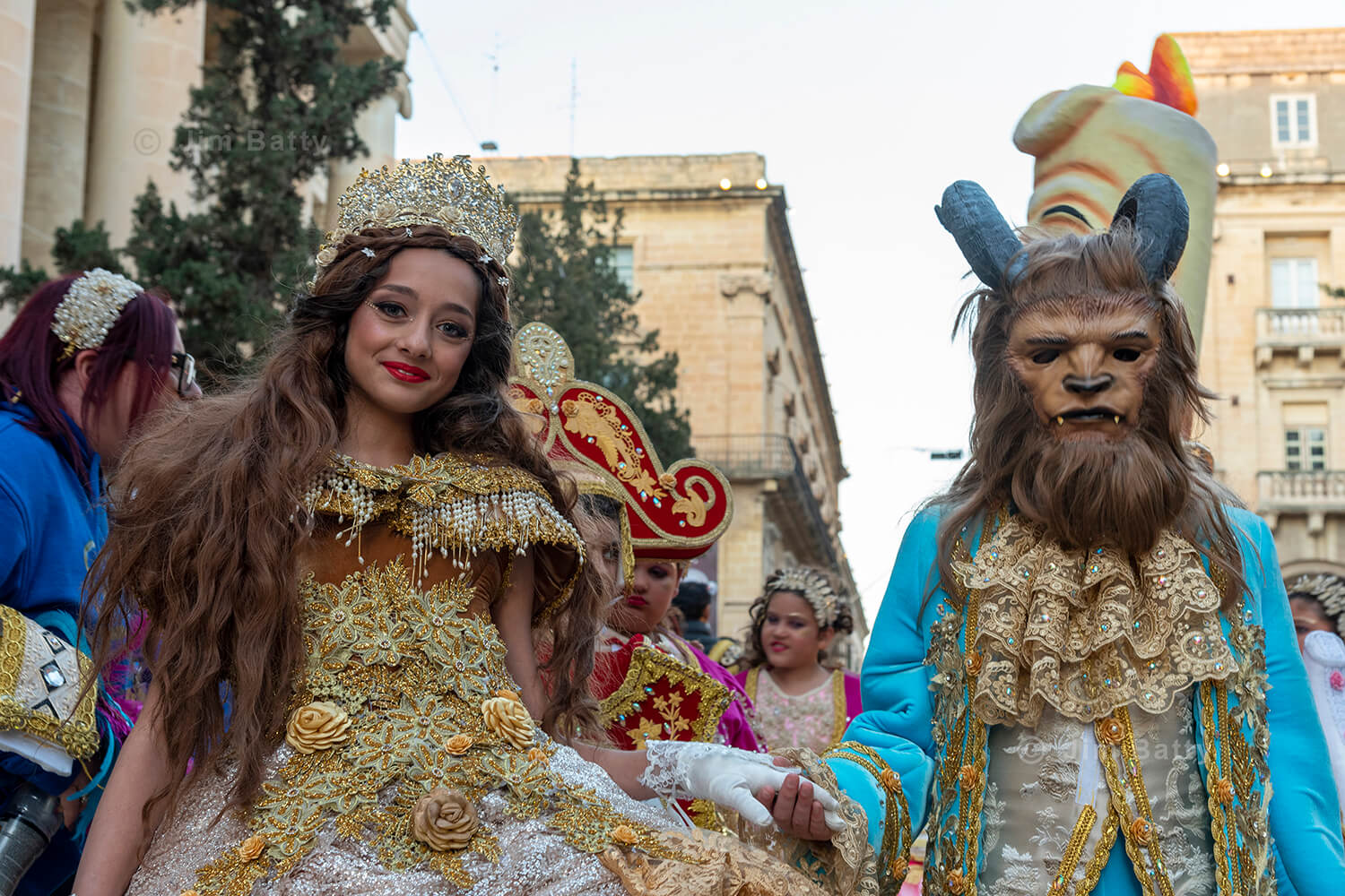 A couple dressed as Beauty and the Beast as part of the Valetta Carnival procession